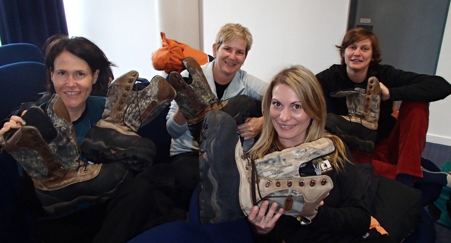 Stefanie (front), with Meg, Sue and Aline holding their practical Antarctic boots.