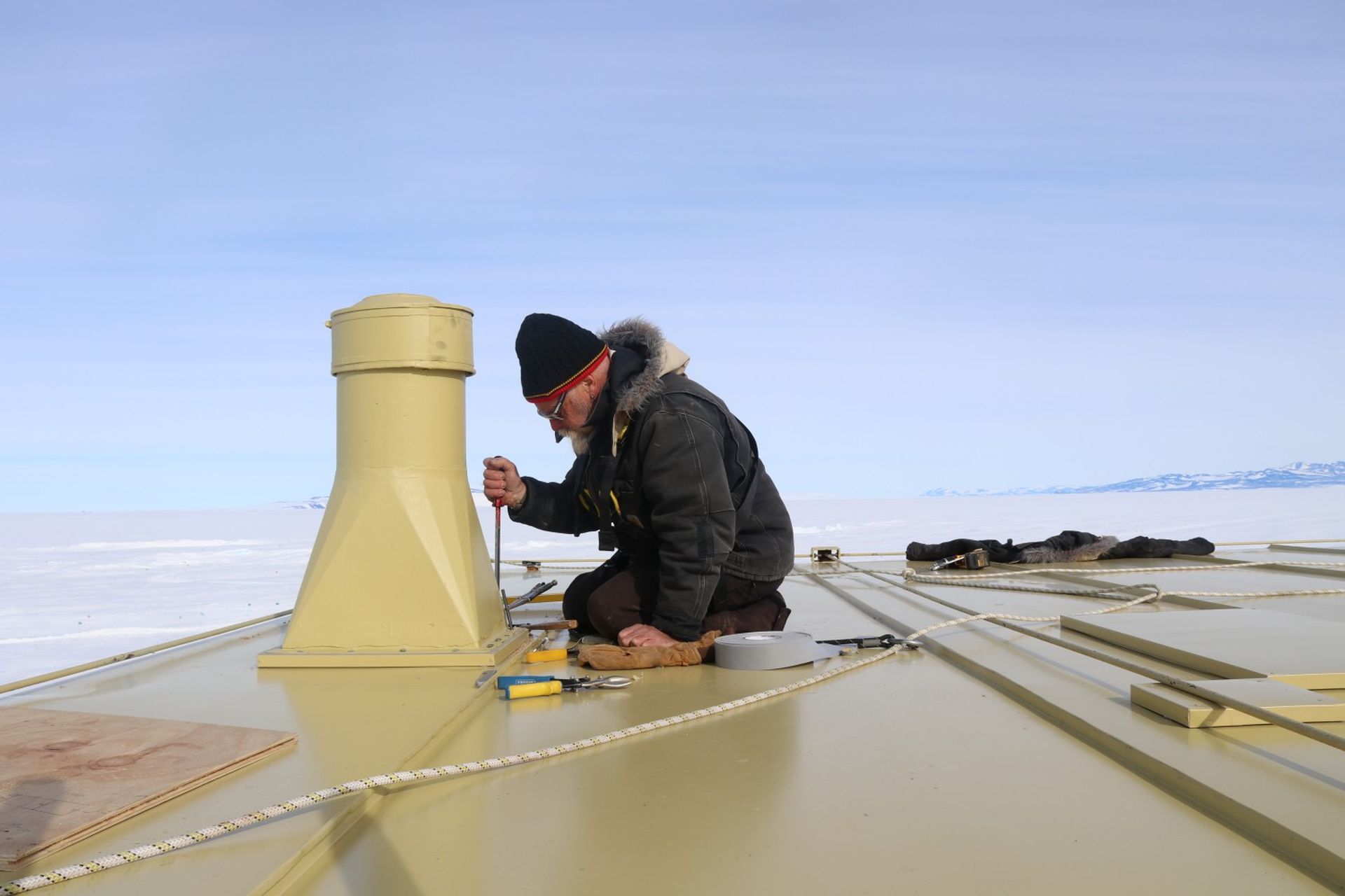 Antarctic Programme Manager Al Fastier working on the roof