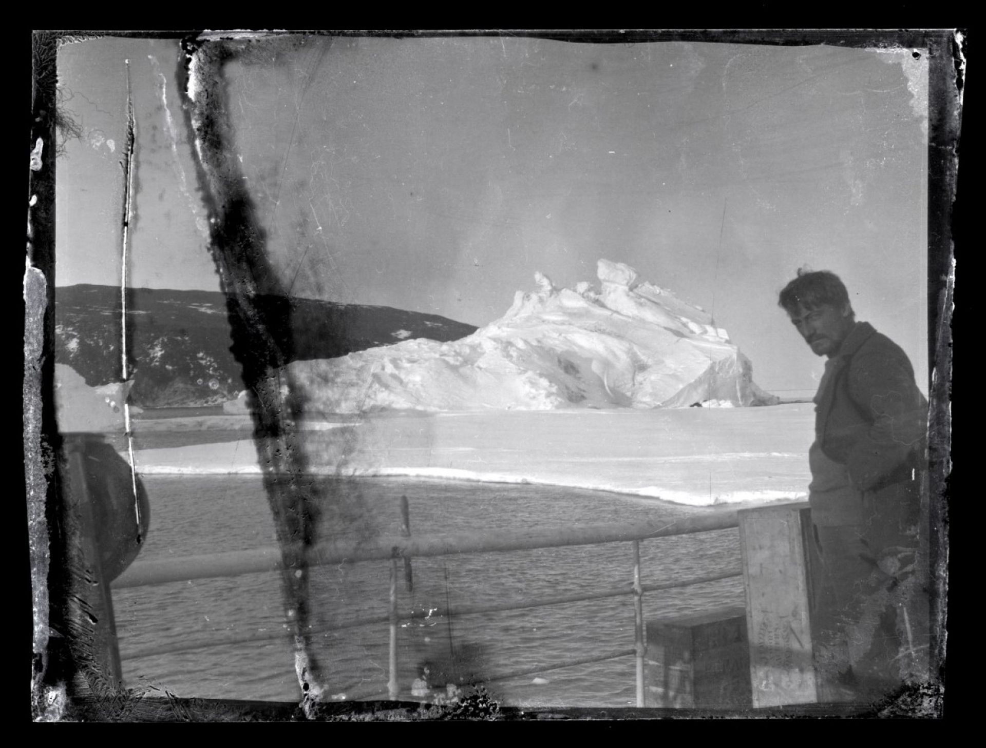 Ross Island, Antarctica. Alexander Stevens, chief scientist and geologist looks south. Hut Point Peninsula in the background