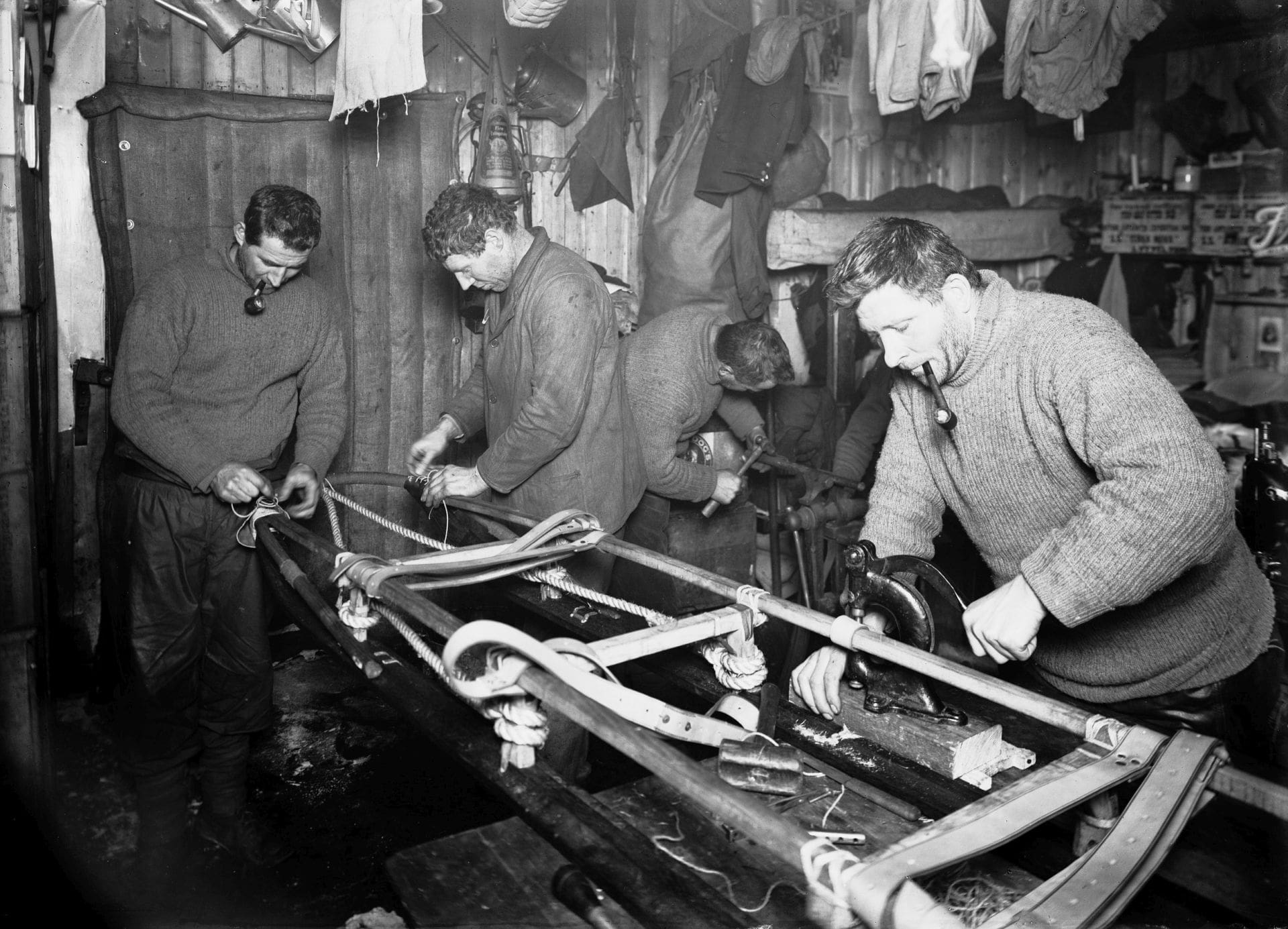 Evans, Forde and Crean assemble a sledge.