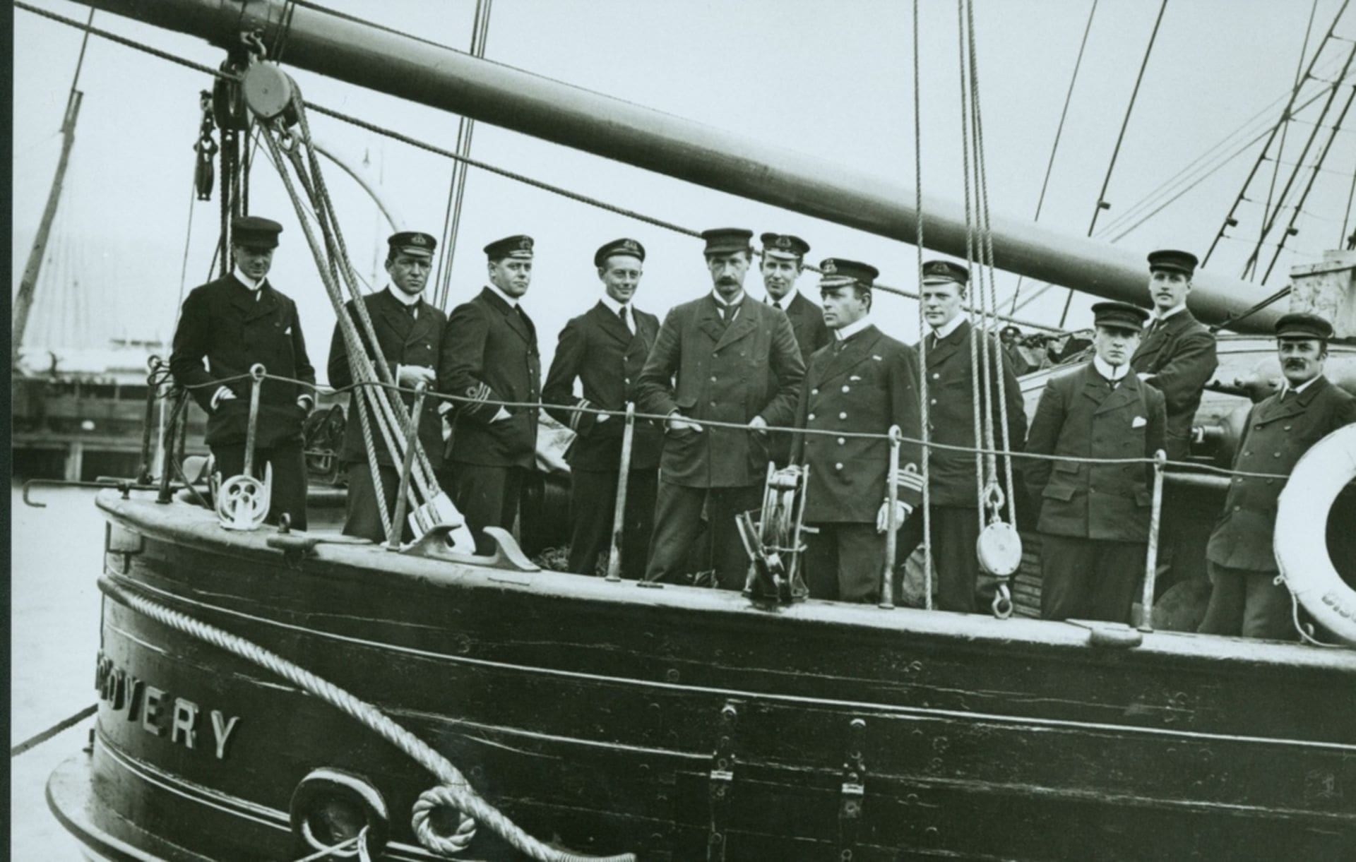 Officers of Discovery on the deck, at Lyttelton, 21 December 1901. Left to right: Dr Wilson, Lt Shackleton, Lt AB Armitage RN, Lt M Barne, Dr Koettlitz, Mr RW Skelton RN, Captain RF Scott RN, Lt CW Royds, Mr LC Bernacchi, Mr HT Ferrar and Mr JF Hodgson.