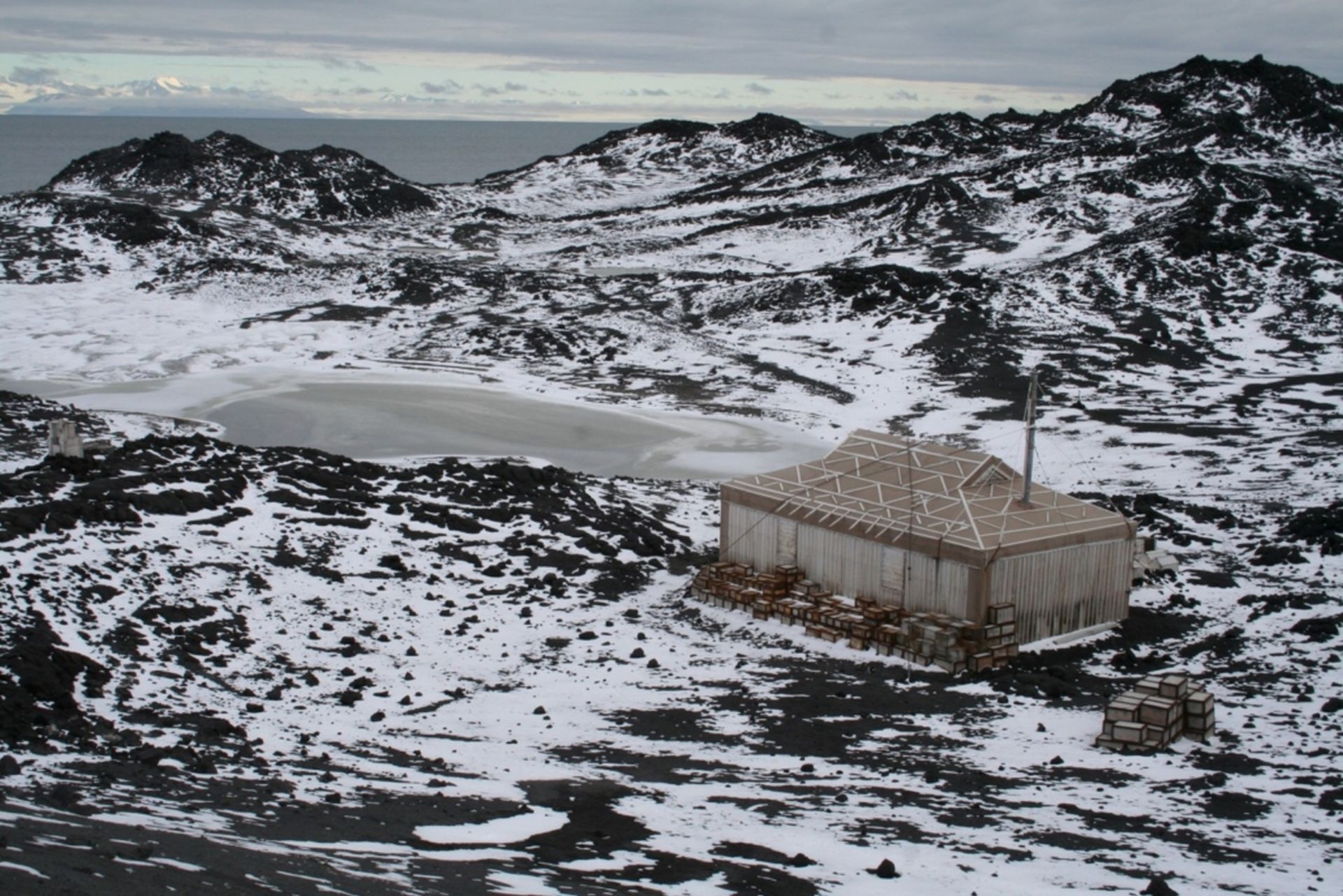 Shackleton’s Nimrod hut sits on an ice-free area of rock at Cape Royds, next to Pony Lake.