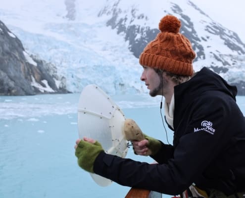 Inspiring Explorer Perry Hyde recording sounds at Drygalski Fjord Inspiring Explorers Expedition South Georgia Antarctic Heritage Trust