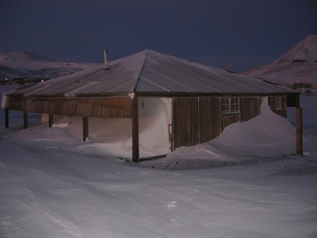 Scott's 'Discovery' hut surrounded by snow.