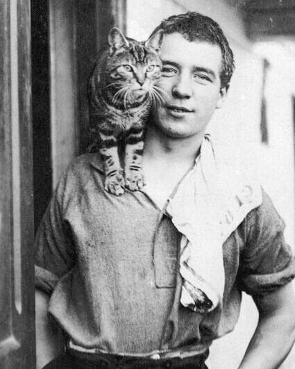 #OnThisDay in 1916, Perce Blackborow, Welsh sailor and famed polar stowaway aboard Shackleton's expedition ship 'Endurance', underwent surgery on Elephant Island to amputate his frostbitten and gangrenous toes.

In 1914 Blackborow and his friend William Blakewell, found themselves in Buenos Aires without a ship. When 'Endurance' arrived in port and two of the crew were sacked, the pair thought their problems were solved. Shackleton interviewed them both and whilst Blakewell was accepted, Blackborow was not, due to his age and lack of experience. With Blakewell's help he was smuggled on board and was eventually discovered three days into the journey.

Despite being unhappy to find the stowaway, Shackleton had no option other than to keep him on board and offered him a steward position. Nicknamed 'Blackie', Blackborow proved to be clever, conscientious and popular with the crew.

On the lifeboat journey from where the 'Endurance' sank to Elephant Island, Blackborow made the mistake of wearing leather rather than the cold weather felt boots that the other men wore, and he developed frostbite in his toes which turned gangrenous. When they arrived at the island, he had to crawl through the surf to reach land and shortly afterwards underwent the surgery which removed all the toes of his left foot.

In the accompanying image, Blackborow is photographed with the cat of Henry McNish the ship's carpenter. Named Mrs Chippy, after the traditional nickname for a carpenter, the cat quickly became the ships mascot.

📸 Perce Blackborow with Mrs Chippy. Frank Hurley, SPRI.

#OTD #inspire #explore #discover #conserve #Antarctica