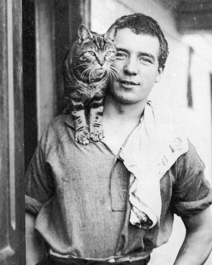 #OnThisDay in 1916, Perce Blackborow, Welsh sailor and famed polar stowaway aboard Shackleton's expedition ship 'Endurance', underwent surgery on Elephant Island to amputate his frostbitten and gangrenous toes.

In 1914 Blackborow and his friend William Blakewell, found themselves in Buenos Aires without a ship. When 'Endurance' arrived in port and two of the crew were sacked, the pair thought their problems were solved. Shackleton interviewed them both and whilst Blakewell was accepted, Blackborow was not, due to his age and lack of experience. With Blakewell's help he was smuggled on board and was eventually discovered three days into the journey.

Despite being unhappy to find the stowaway, Shackleton had no option other than to keep him on board and offered him a steward position. Nicknamed 'Blackie', Blackborow proved to be clever, conscientious and popular with the crew.

On the lifeboat journey from where the 'Endurance' sank to Elephant Island, Blackborow made the mistake of wearing leather rather than the cold weather felt boots that the other men wore, and he developed frostbite in his toes which turned gangrenous. When they arrived at the island, he had to crawl through the surf to reach land and shortly afterwards underwent the surgery which removed all the toes of his left foot.

In the accompanying image, Blackborow is photographed with the cat of Henry McNish the ship's carpenter. Named Mrs Chippy, after the traditional nickname for a carpenter, the cat quickly became the ships mascot.

📸 Perce Blackborow with Mrs Chippy. Frank Hurley, SPRI.

#OTD #inspire #explore #discover #conserve #Antarctica